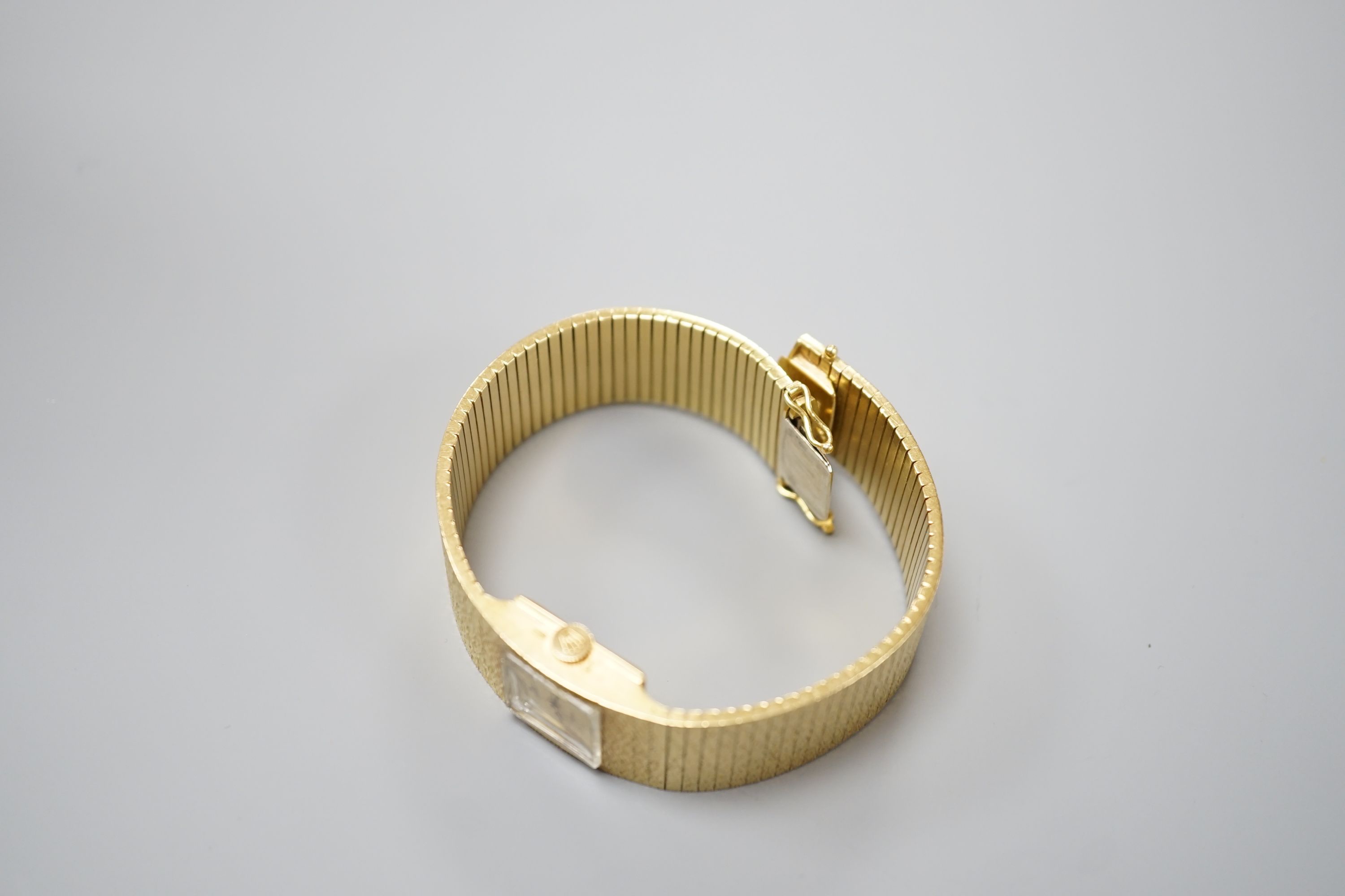 A lady's 1960's textured 18ct gold Rolex Precision manual wind bracelet watch, case diameter 17mm, gross weight 70.3 grams, with Rolex box, no papers.